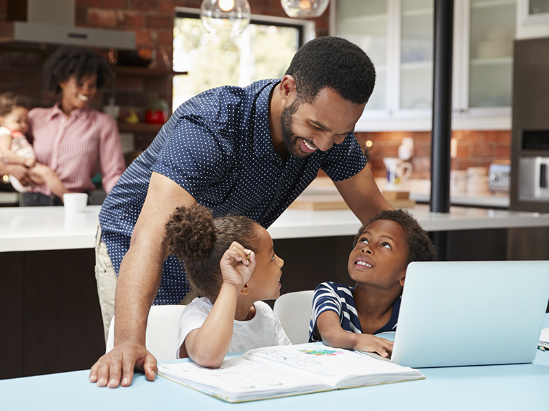 Parent helping a child practice spelling at home with Spelling Stars